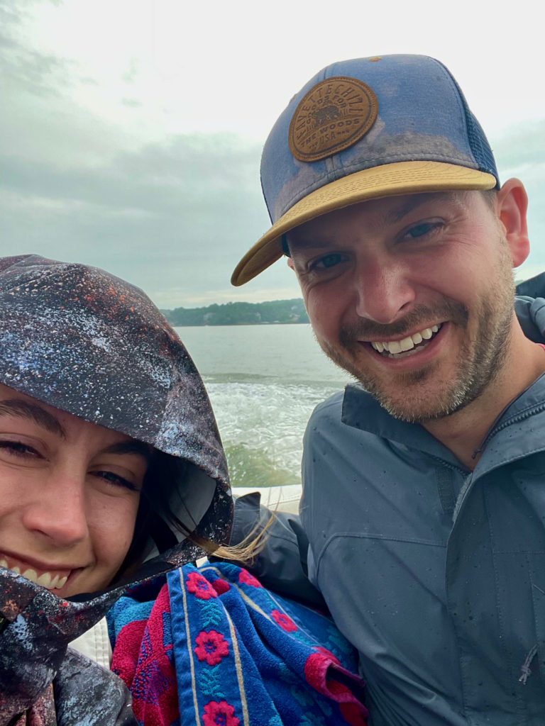 Carly and Sean huddled in the rain on Lake of the Ozarks