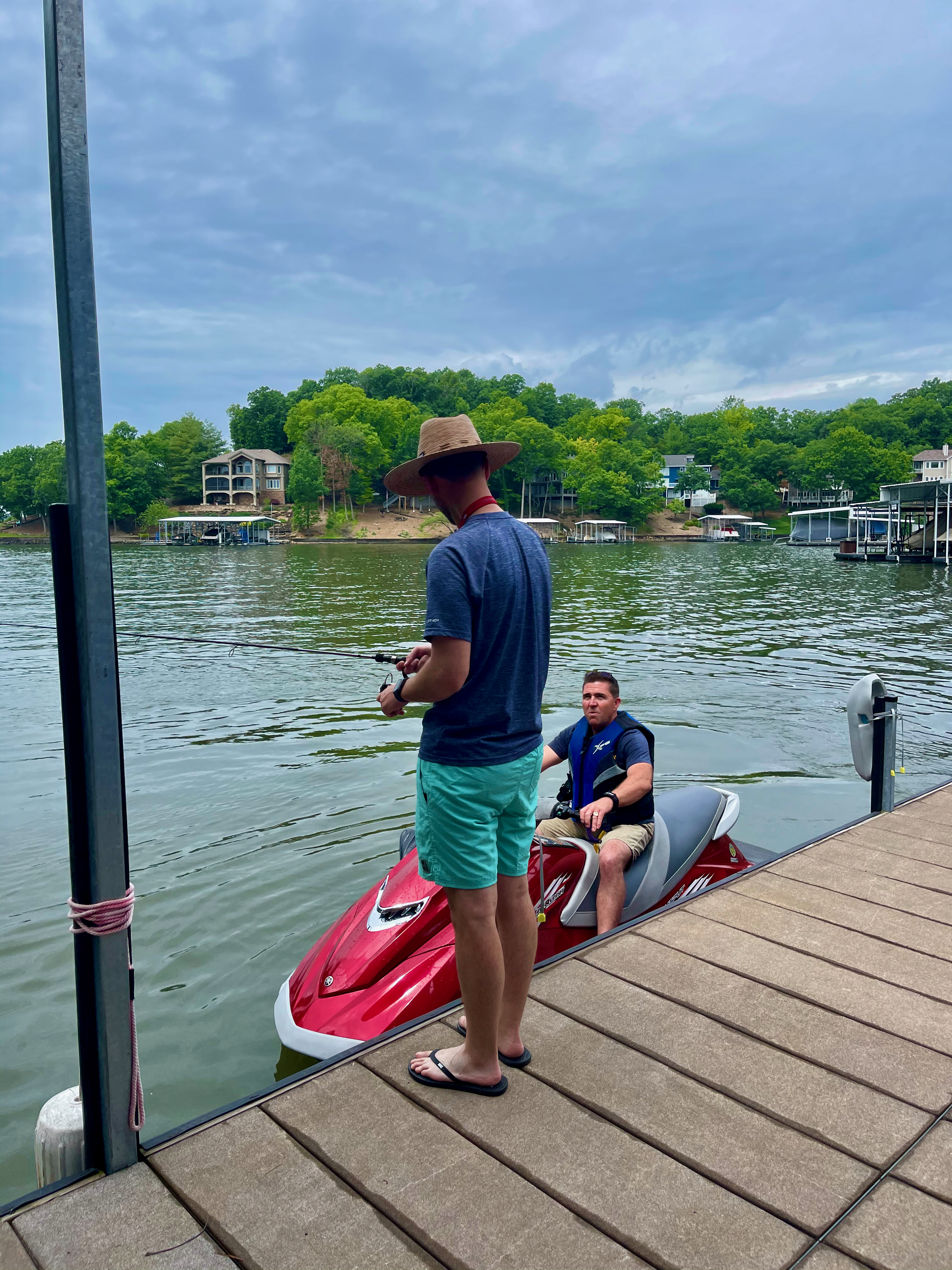 Sean attempting to fish off the dock with Steve instructing